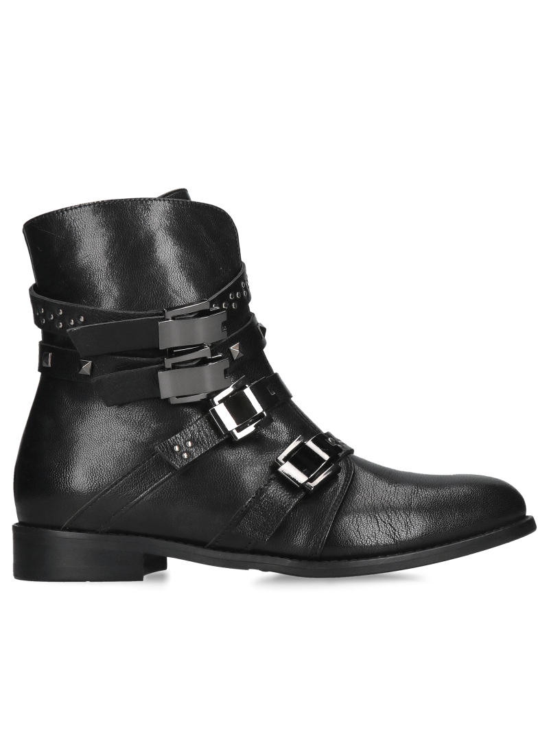 Original and unique women's insulated boots with decorative buckles, leather winter boots from a Polish manufacturer.
