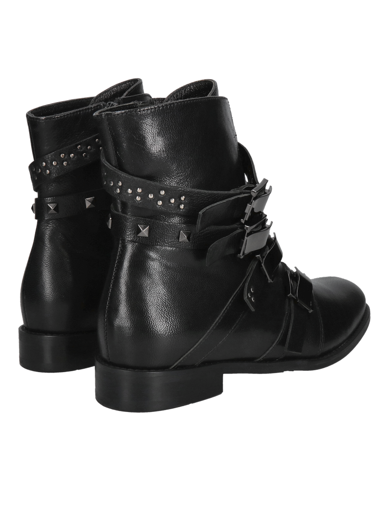 Original and unique women's insulated boots with decorative buckles, leather winter boots from a Polish manufacturer.