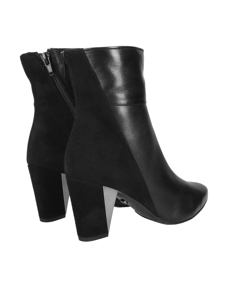 Elegant suede ankle boots with decorative heels, combining elegance and comfort in one