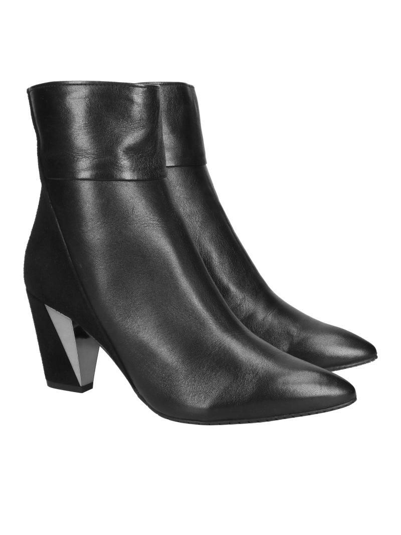 Elegant suede ankle boots with decorative heels, combining elegance and comfort in one