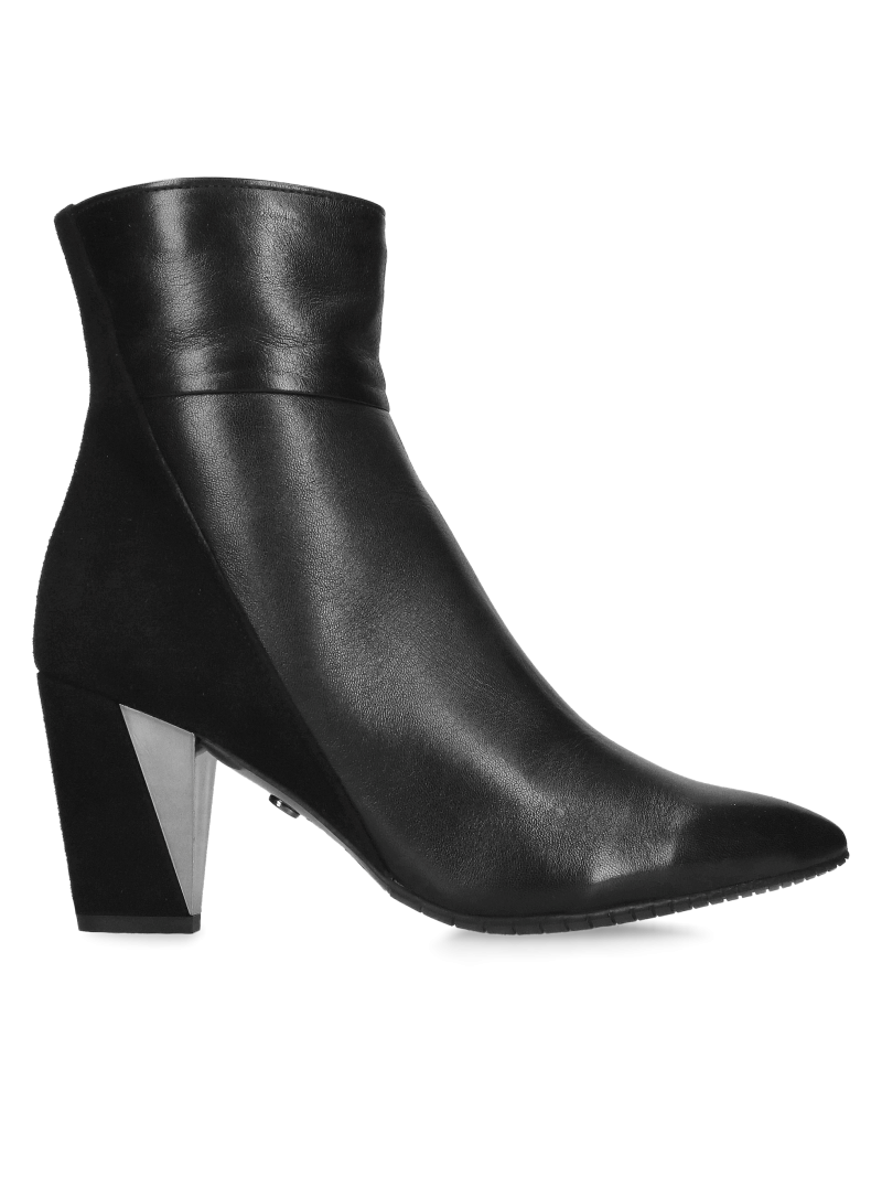Elegant suede ankle boots with decorative heels, combining elegance and comfort in one