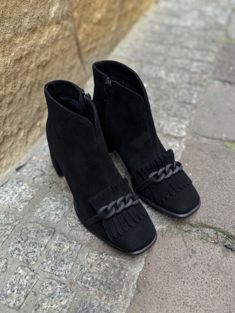 Women's black ankle boots with a block heel and decorative chain on the toe