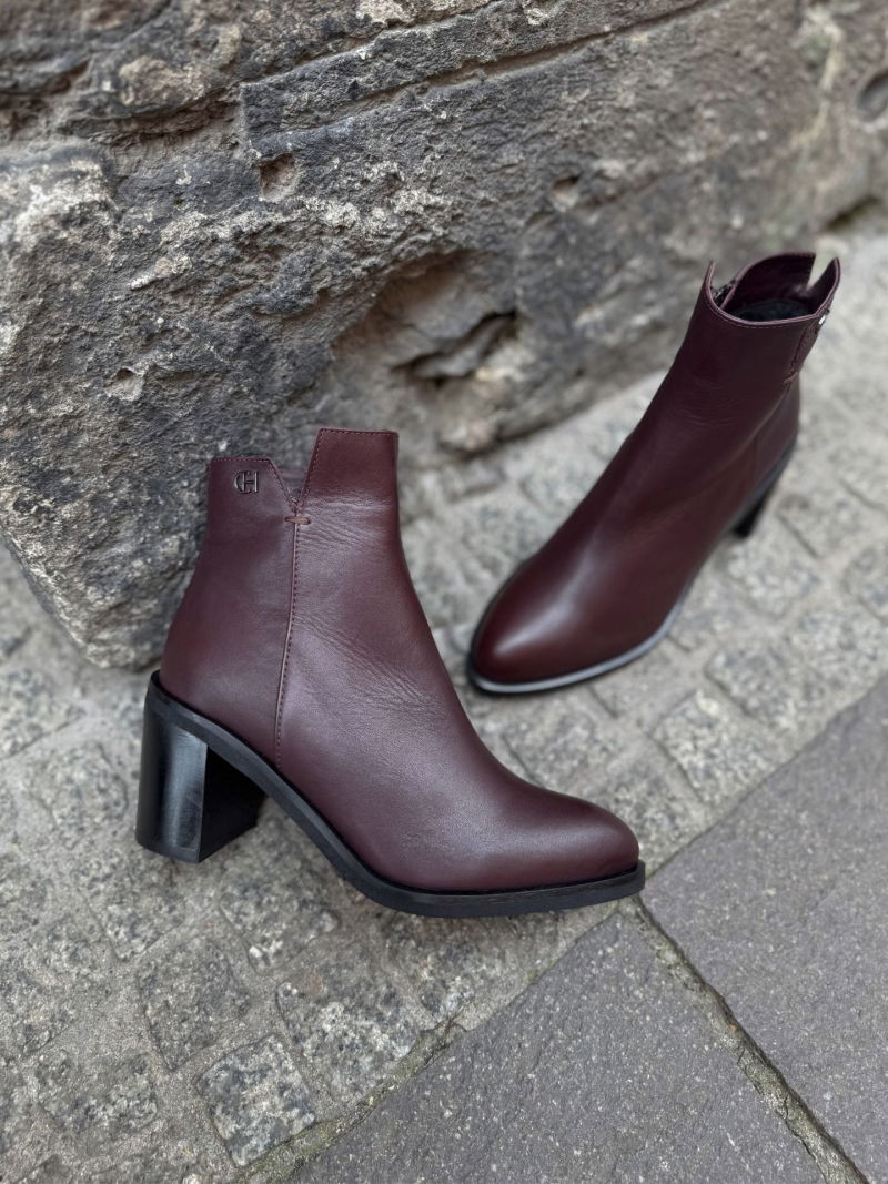 Heeled ankle boots, elegant leather boots in a dark burgundy shade of leather