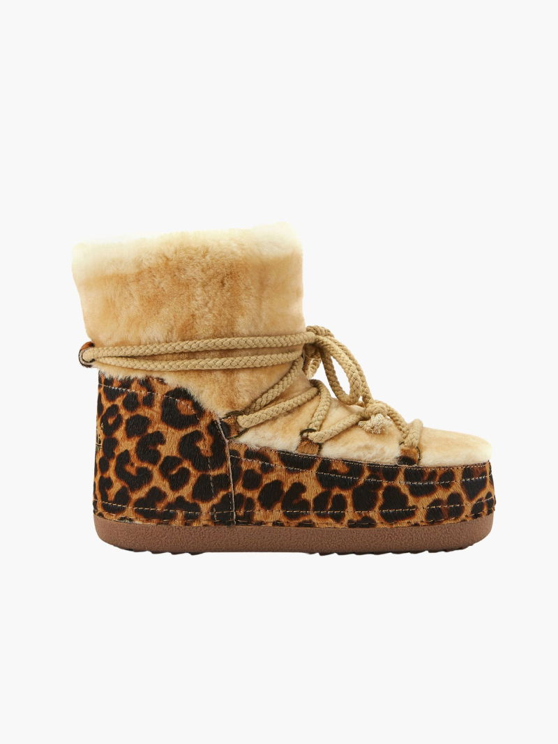 Winter boots on a platform, women's snow boots with natural sheepskin lining