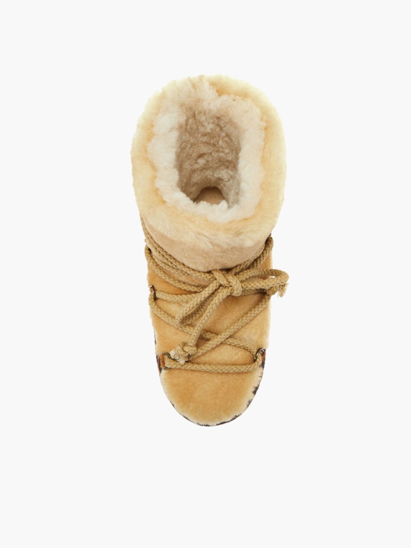 Winter boots on a platform, women's snow boots with natural sheepskin lining