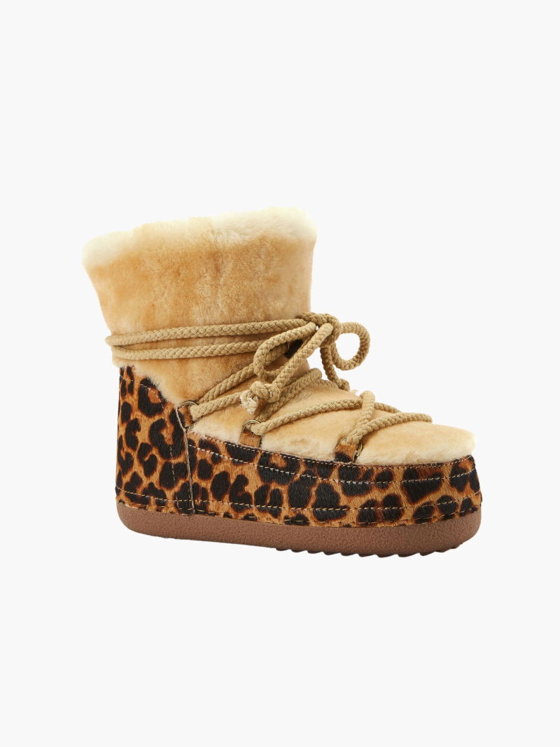 Winter boots on a platform, women's snow boots with natural sheepskin lining