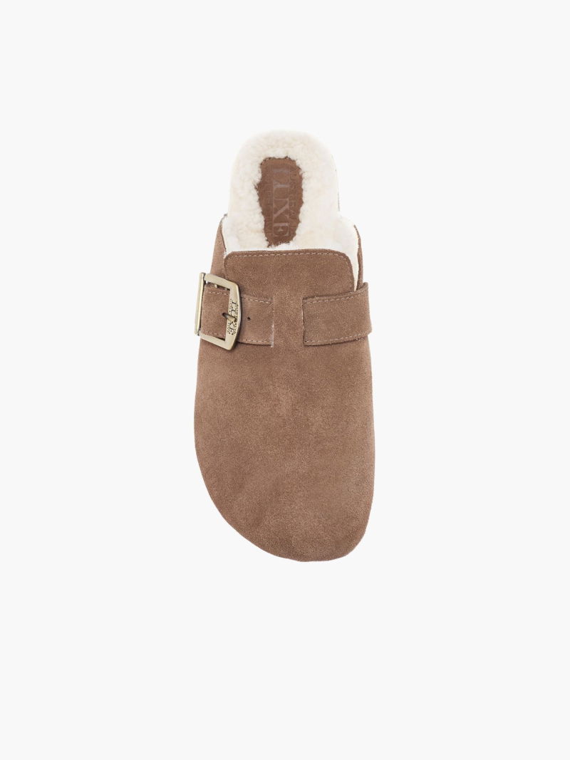 Soft suede clogs with a side buckle. Comfortable sheepskin insole and molded sole.