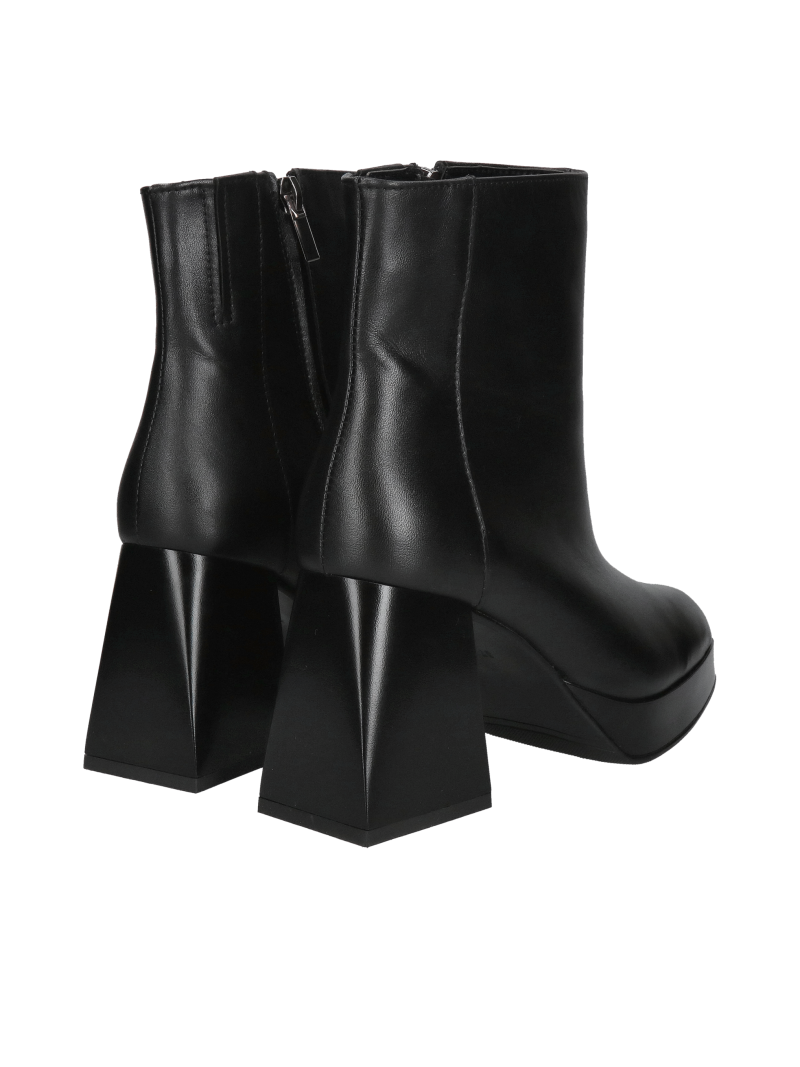 Fashionable women's boots with thick heels, elegant boots made of grain leather
