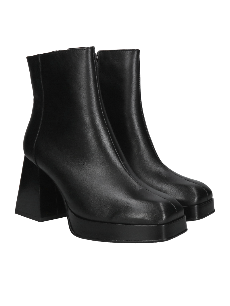 Fashionable women's boots with thick heels, elegant boots made of grain leather