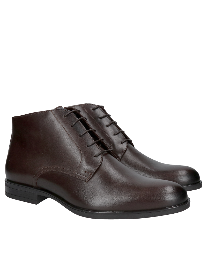 Insulated brown men's winter boots lined with natural sheepskin