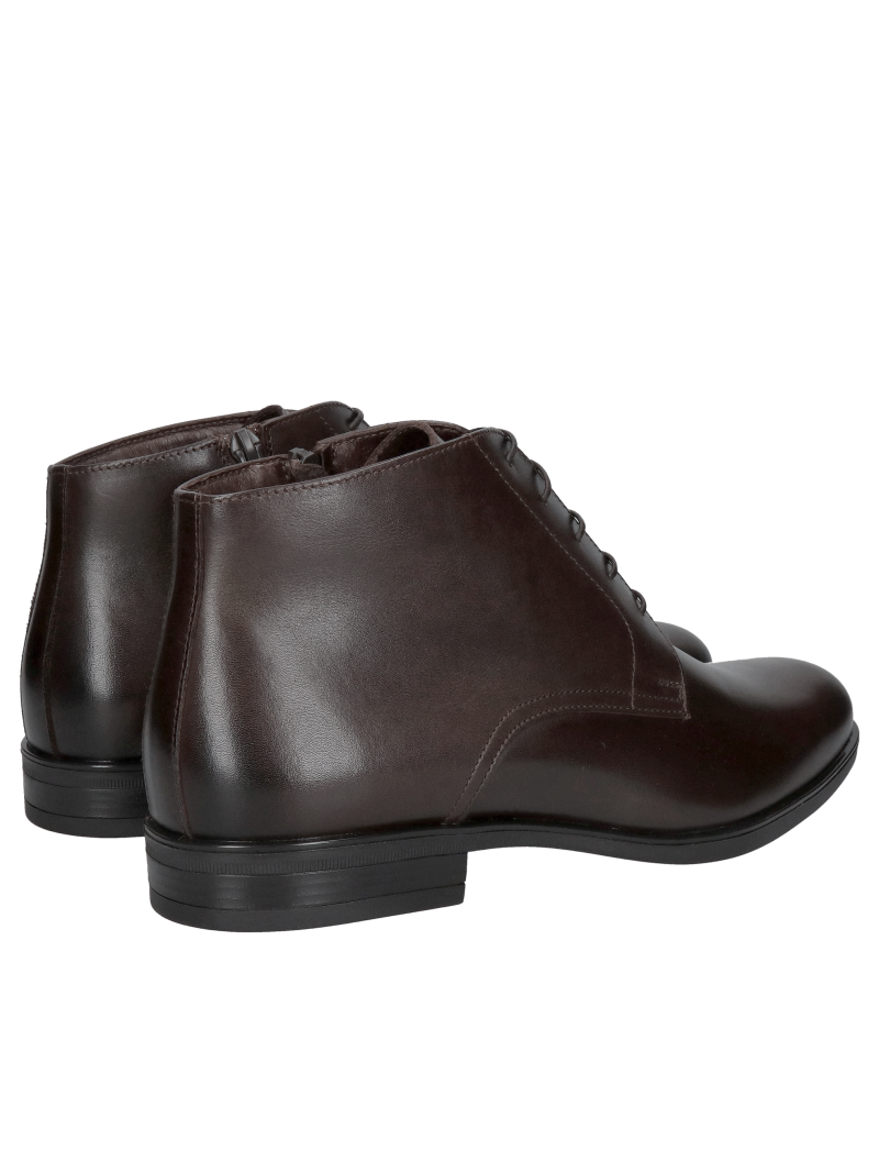Insulated brown men's winter boots lined with natural sheepskin