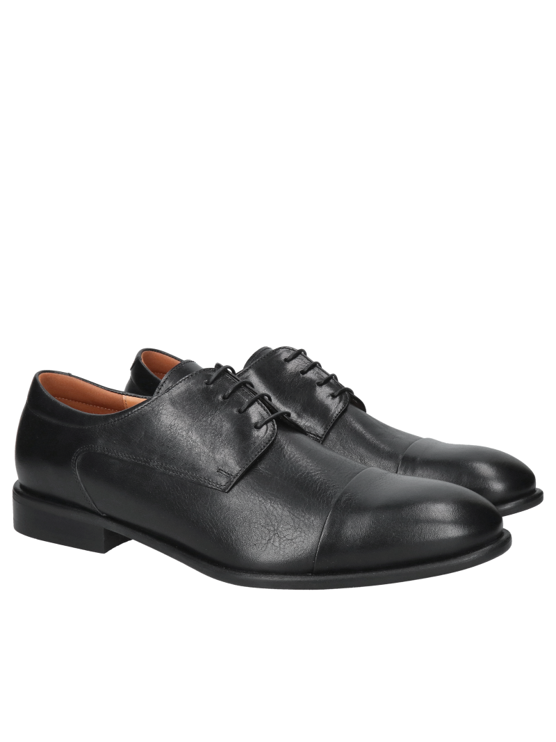 Elegant black men's dress shoes, formal shoes with a cut-out detail made of genuine leather