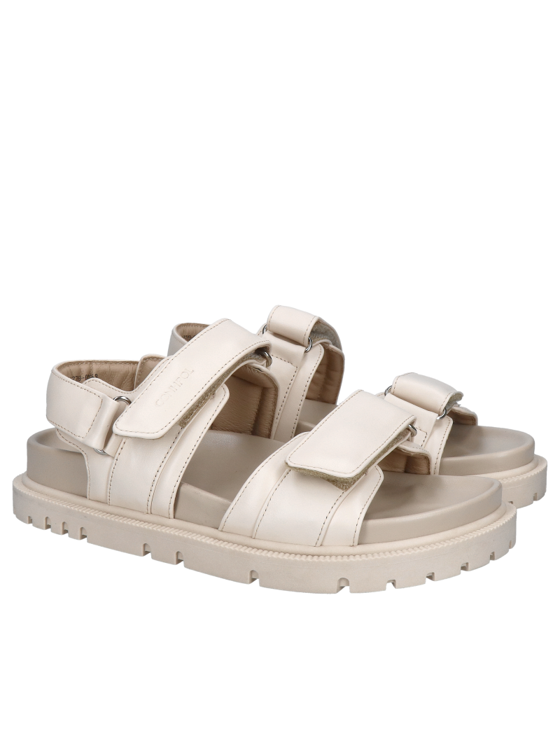 Stylish, chunky cream-colored sandals made of soft full-grain leather; premium sandals with a thick sole