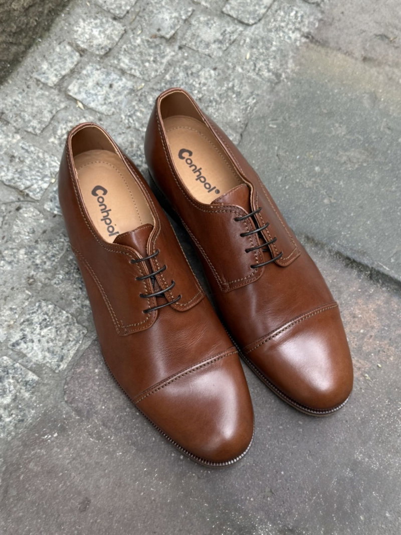 Brown height-increasing shoes made of genuine leather from a Polish manufacturer