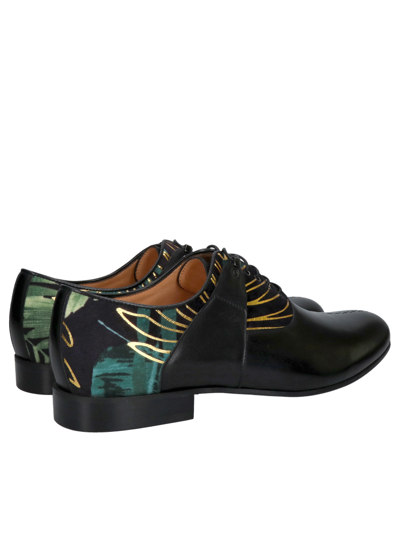 A unique pair of men’s Oxford shoes, made from black full-grain leather combined with decorative suede