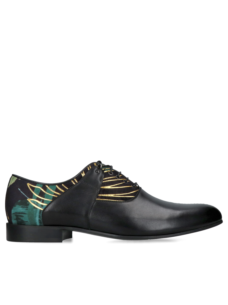 A unique pair of men’s Oxford shoes, made from black full-grain leather combined with decorative suede