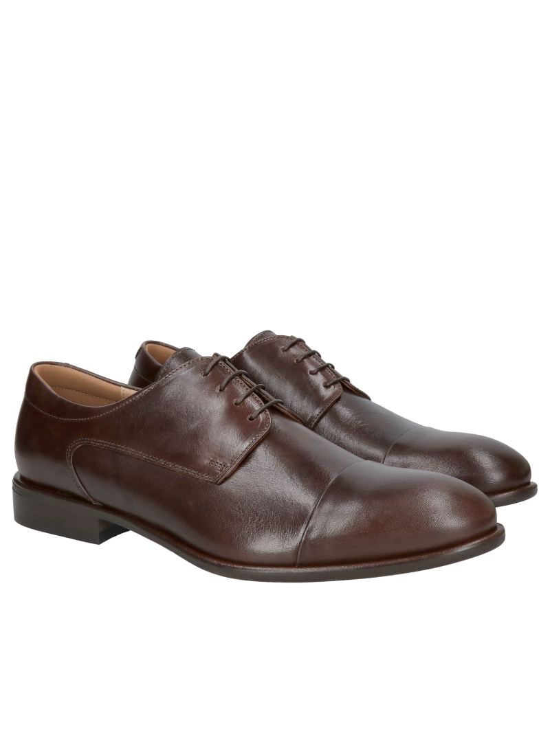 Elegant suit shoes with stitching in a beautiful shade of brown and a slightly protruding, elegant heel at the base