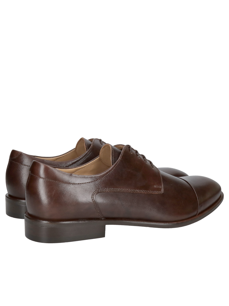 Elegant suit shoes with stitching in a beautiful shade of brown and a slightly protruding, elegant heel at the base