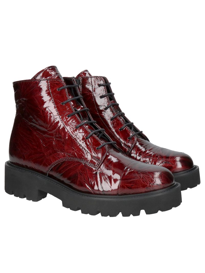 Women's burgundy patent leather ankle boots with a thick, lightweight sole